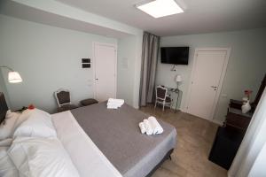 Posteľ alebo postele v izbe v ubytovaní B&B Attico 33