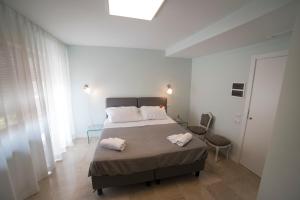 Posteľ alebo postele v izbe v ubytovaní B&B Attico 33