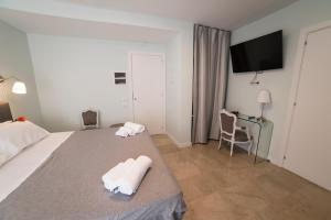 Posteľ alebo postele v izbe v ubytovaní B&B Attico 33