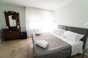 Posteľ alebo postele v izbe v ubytovaní B&B Attico 33