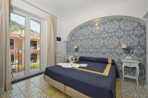 Postel nebo postele na pokoji v ubytování Hotel7Bello + 37 fotografií