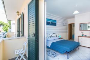 A bed or beds in a room at Residence Kimba