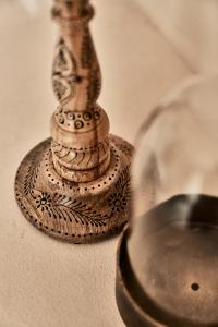 a glass bottle sitting on top of a table at Istoria, a Member of Design Hotels in Perivolos