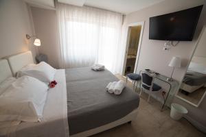Posteľ alebo postele v izbe v ubytovaní B&B Attico 33
