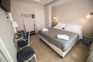 Posteľ alebo postele v izbe v ubytovaní B&B Attico 33