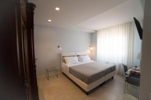 Posteľ alebo postele v izbe v ubytovaní B&B Attico 33