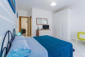 A bed or beds in a room at Residence Kimba