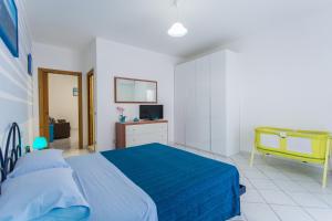 A bed or beds in a room at Residence Kimba