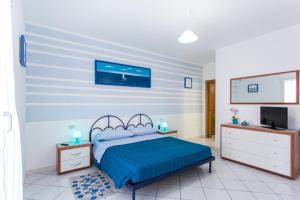 A bed or beds in a room at Residence Kimba
