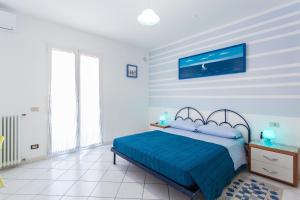 A bed or beds in a room at Residence Kimba