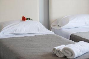 Posteľ alebo postele v izbe v ubytovaní B&B Attico 33