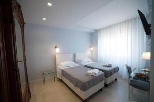 Posteľ alebo postele v izbe v ubytovaní B&B Attico 33