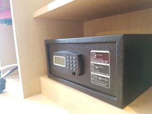 a microwave oven sitting in a drawer in a room at Kavin Buri Green Hotel in Udon Thani