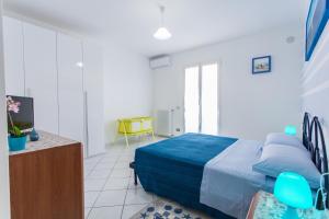A bed or beds in a room at Residence Kimba