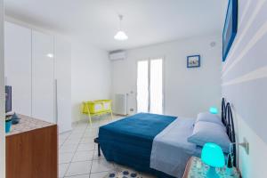 A bed or beds in a room at Residence Kimba