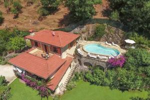 an aerial view of a house with a swimming pool at Villa Romantica Sea View in Camaiore