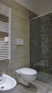 a bathroom with a toilet and a shower and a sink at Marselo B&B in Bari +21 photos