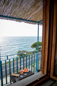 a view from the balcony of a balcony overlooking the ocean at Oasi Relais in Vico Equense