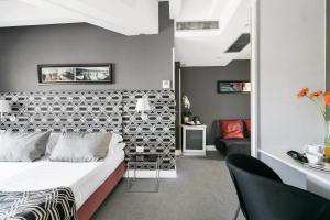 Un pat sau paturi într-o cameră la Hotel La Rovere