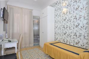 Postel nebo postele na pokoji v ubytování Hotel7Bello