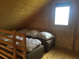 Postel nebo postele na pokoji v ubytování Kayman