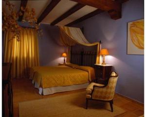 En eller flere senge i et værelse på La Casita de Cabrejas