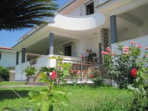 a house with a garden in front of it at Bed and Breakfast Villa Viviana in Anzio