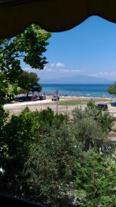a view of a beach with the ocean in the background at Vicente House in Skala Rachoniou