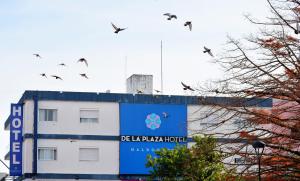 a building with a sign on the side of it at De la Plaza Hotel in Maldonado