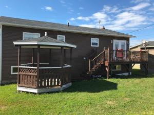 a house with a gazebo in the yard at Aggie's B&B in Bonavista