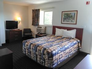 Motel 6-Greensboro, NC - I-40 tesisinde bir odada yatak veya yataklar