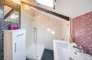 a bathroom with a sink and a shower at Lina's Sea View Apartments in Limenas +17 photos