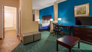 a hotel room with a bed and a desk at Best Western Wesley Chapel in Wesley Chapel