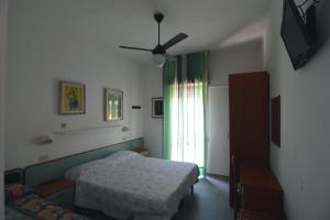 Postel nebo postele na pokoji v ubytování Hotel VistaMare Viserba