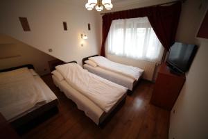 Postel nebo postele na pokoji v ubytování Eged Vendégház