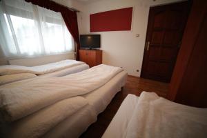 Postel nebo postele na pokoji v ubytování Eged Vendégház