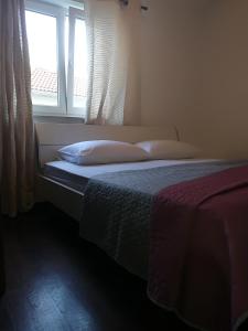Posteľ alebo postele v izbe v ubytovaní Apartman Brzović