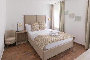 Postel nebo postele na pokoji v ubytování Residence Mutschellen + 37 fotografií
