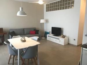 TV a/nebo společenská místnost v ubytování Apartamento frente al mar