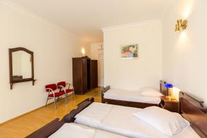 Ένα ή περισσότερα κρεβάτια σε δωμάτιο στο Hotel Simpatia