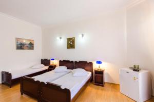 Ένα ή περισσότερα κρεβάτια σε δωμάτιο στο Hotel Simpatia