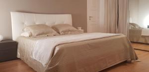 Säng eller sängar i ett rum på Villa Belmonte