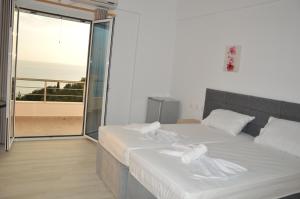 Postel nebo postele na pokoji v ubytování Mihalis Apartments