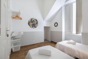 Katil atau katil-katil dalam bilik di Faro Cosy Guesthouse