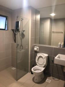 a bathroom with a shower and a toilet and a sink at Setia Walk Puchong in Puchong