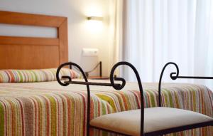 Postel nebo postele na pokoji v ubytování Apartamentos La Barzana
