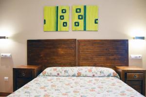 Postel nebo postele na pokoji v ubytování Apartamentos La Barzana