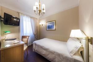 Postel nebo postele na pokoji v ubytování Phi Hotel Principe