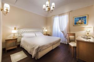 Postel nebo postele na pokoji v ubytování Phi Hotel Principe