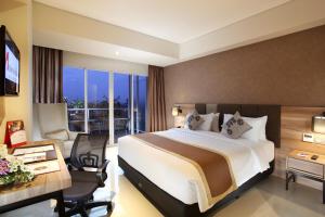 Ein Bett oder Betten in einem Zimmer der Unterkunft Swiss-Belinn Karawang